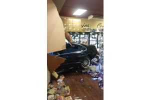 Vehicle into Holiday Market